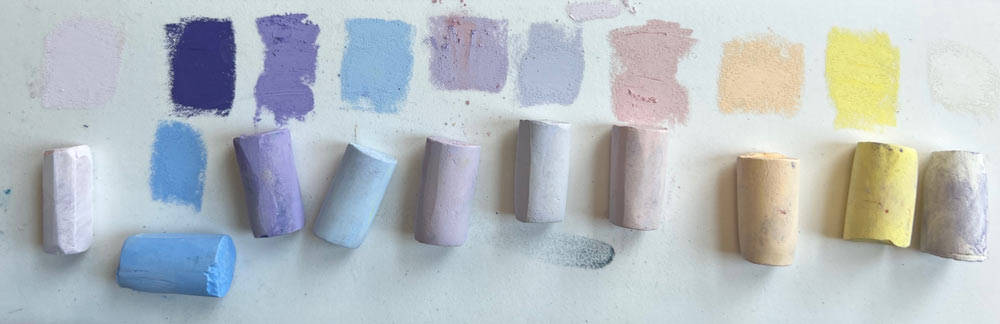 The pastels used in the challenge, laid out in a row.